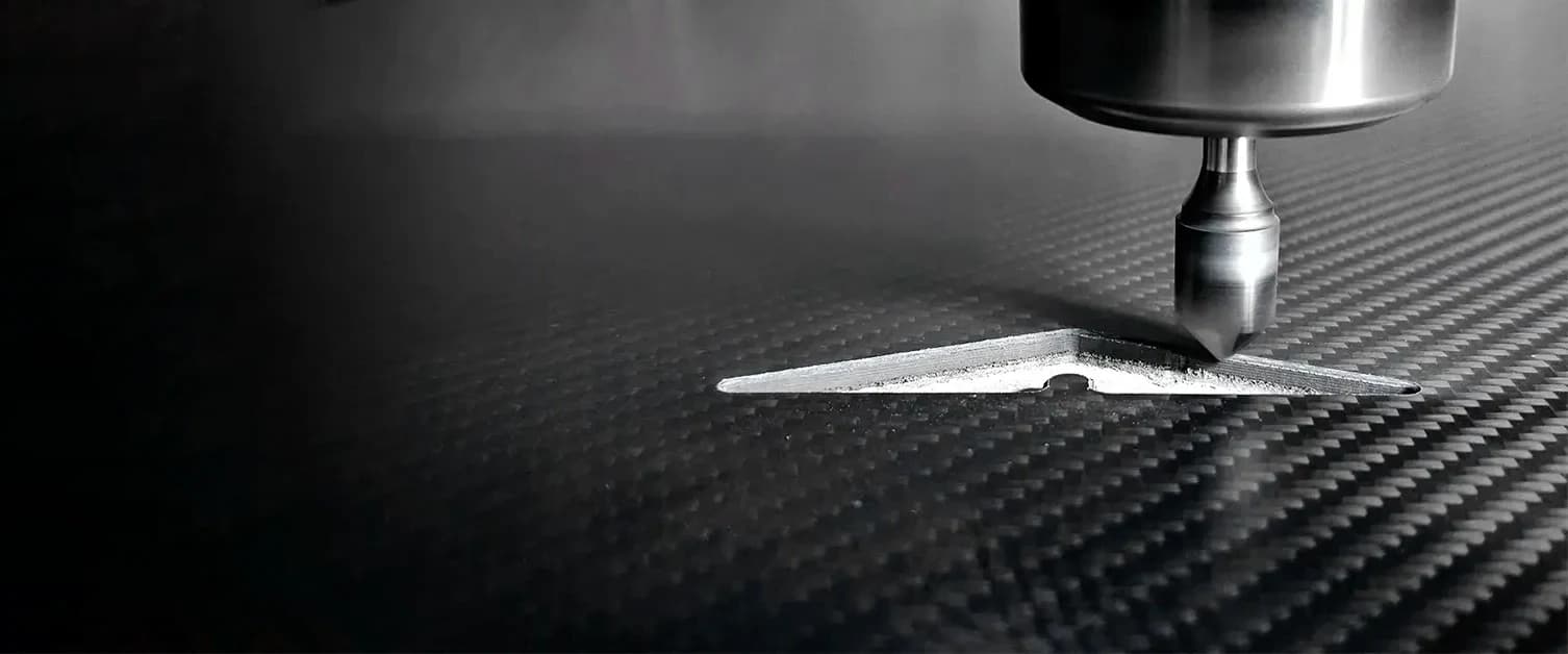 CNC tool machining a custom carbon fiber sheet