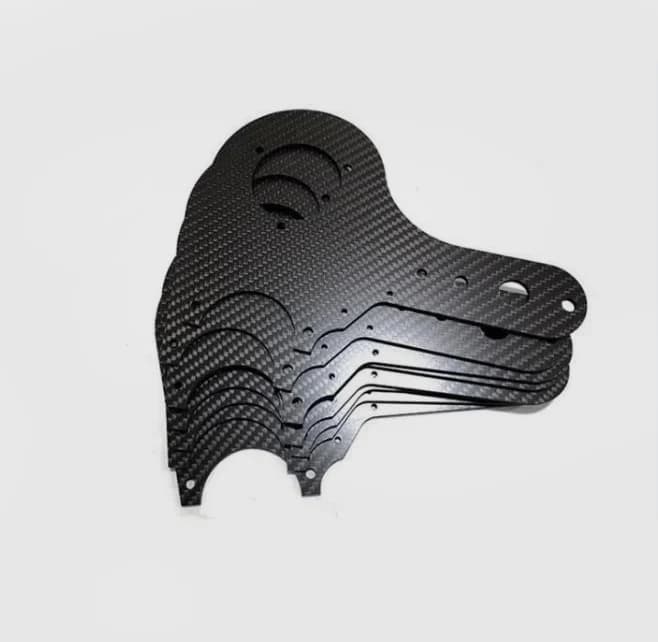 Stacked matte carbon fiber machined parts