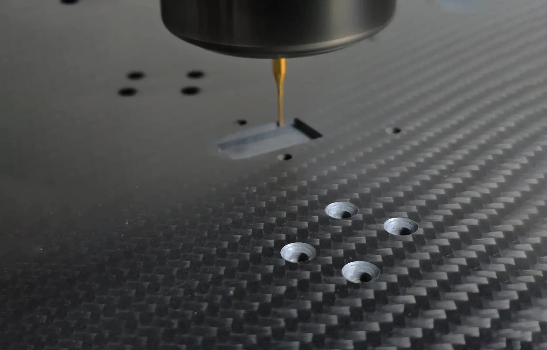 Close-up CNC machining carbon fiber material