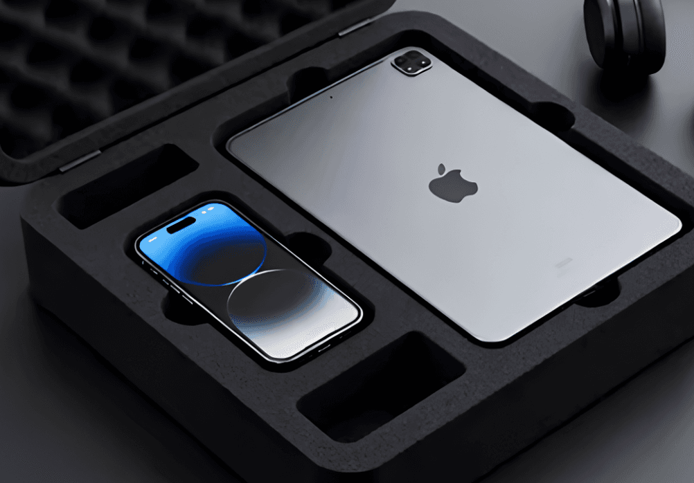 Black foam insert box holding a phone and tablet