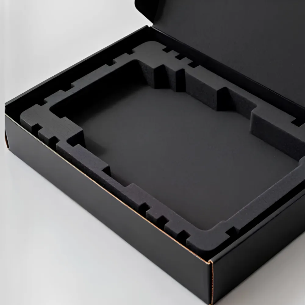 Black foam insert fitted inside a product box