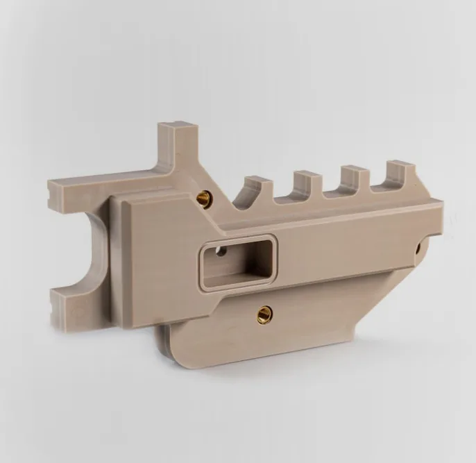 Precision machined beige plastic bracket component