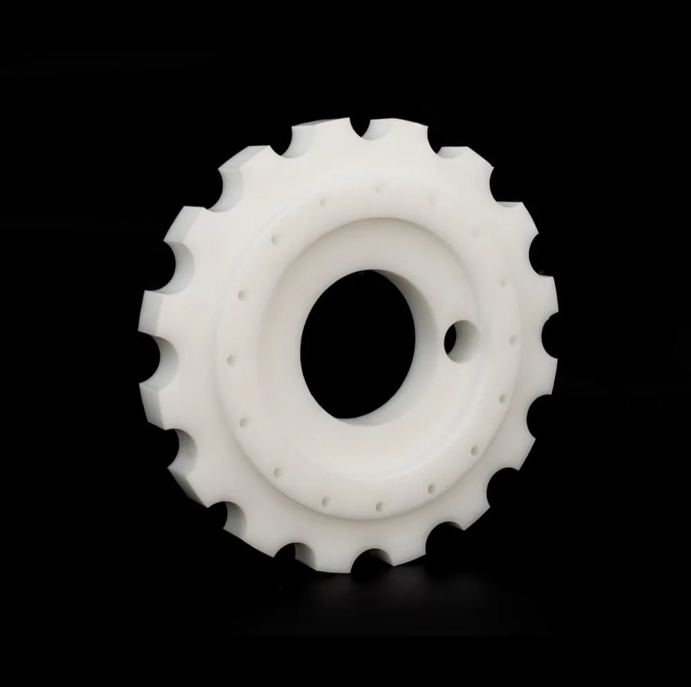 White machined plastic sprocket component